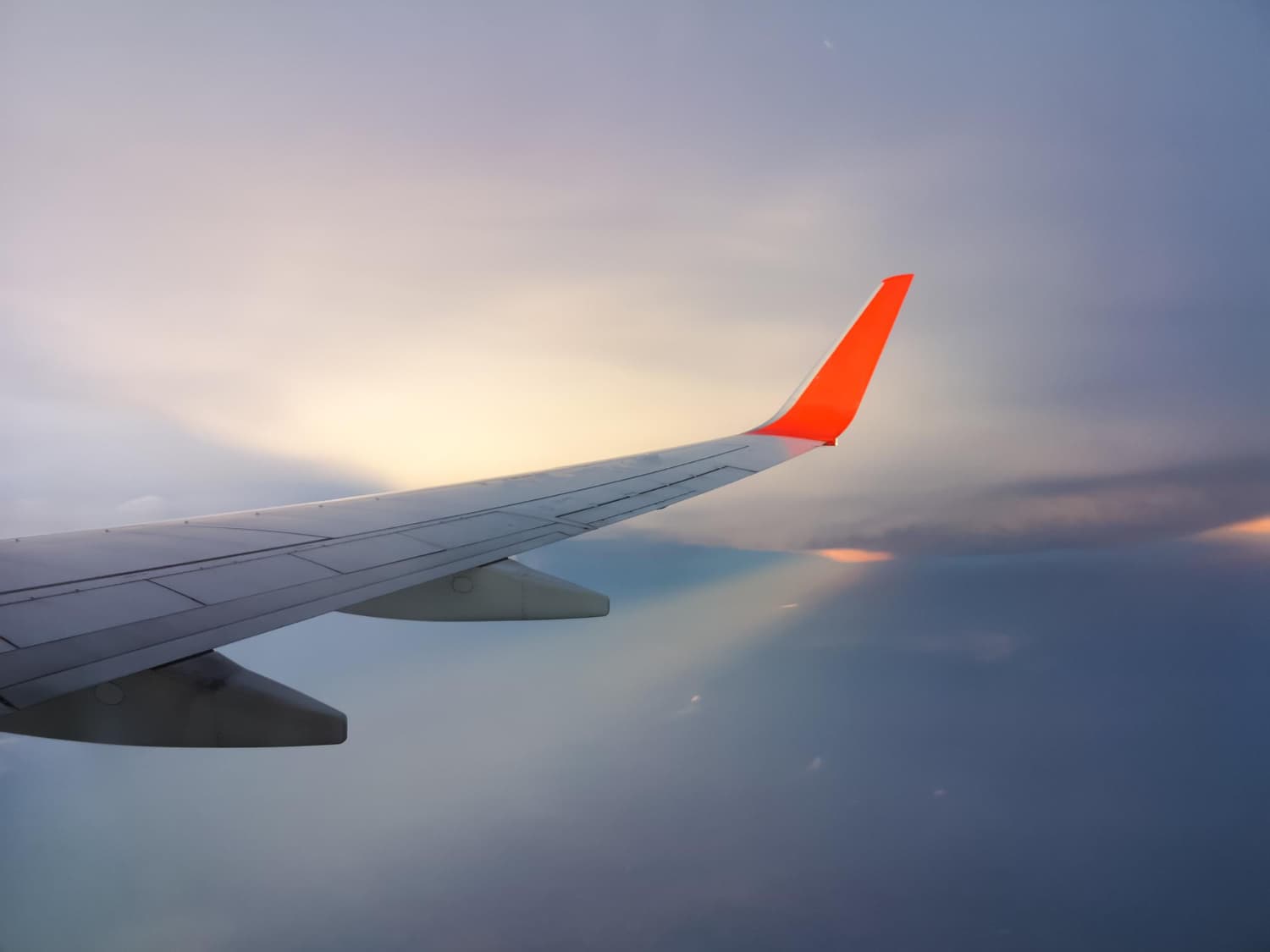 Aircraft wing above the clouds